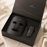 Solvana Glow Premium-Verpackung: schwarze Geschenkbox mit Maske und Controller im Inlay
